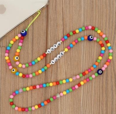 China Environmentally Friendly Glass Eye Bead Woven Beaded Mobile Phone Strap Women Candy Color Pendant Cell Phone Chain Long for sale