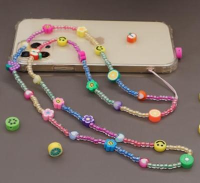 China Environmentally friendly flower fruit smiling color beaded 80cm acrylic and soft ceramic mixed chain cell phone anti-lost strap for sale