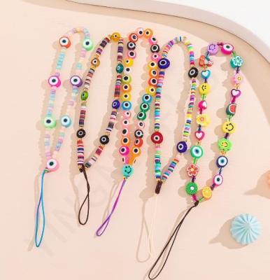 China Environmentally friendly new color clay mix and match mobile phone chain fruit acrylic smiley face anti-drop soft beaded cell phone lanyard for sale