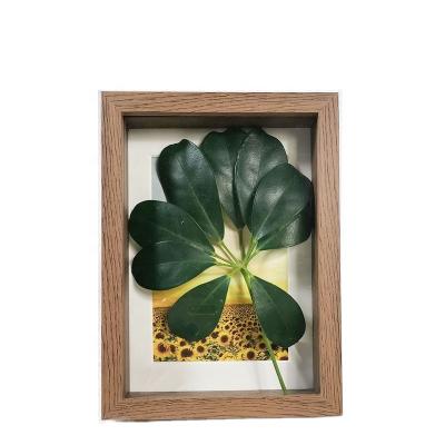 China Wholesale 3D Feather Picture Frame Hollow Photo Wooden Creative Paper View 7 Inch for sale