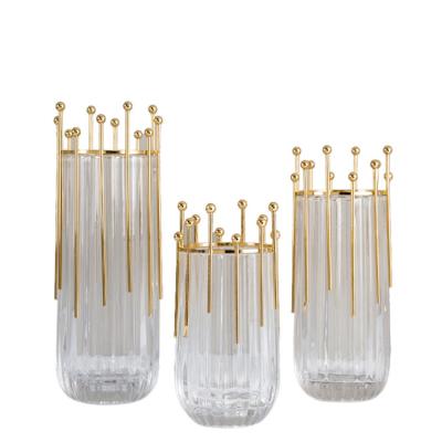 China Modern Diamond Star Wholesale Custom Home Decoration Clear Glass Flower Vases With Metal Stand for sale