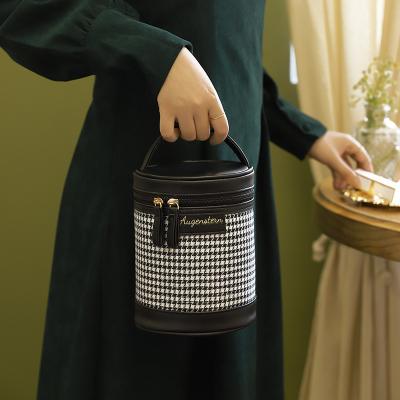 China Fashion Houndstooth Makeup Bag Cosmetics Storage Bag Women Portable PU Cylinder Makeup Bag for sale