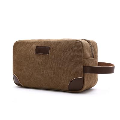 China Canvas cosmetic bag solid-color handbag coin purse bulky casual portable unisexual bag convenient storage bag for sale