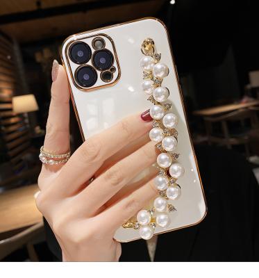 China Low MOQ Diamond Pearl Shockproof Luxury Wristband Plating Soft Back Cover For Apple iphone11 pro 12 X i8p Max Max anti-drop phone case for sale