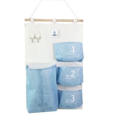 China ICEBLUE HD Modern Single Door Wall Hanging Storage Bag with Cloth Holder Cotton Canvas Hanging Organizer for sale