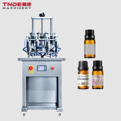 China No Filling Perfume TDG-SZY04 Automatic Bottle Filling Machine Photoelectric Water Liquid Four Head Non Vacuum Filling Machines for sale