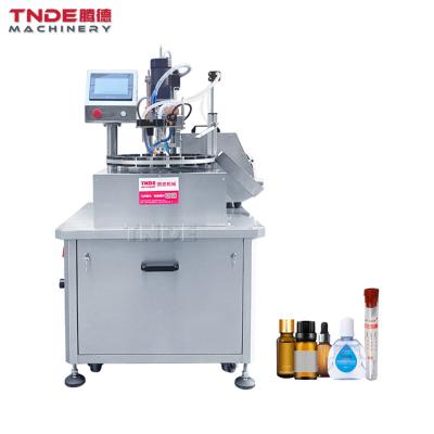 China Automatic Magnetic Pump Food TNDE Essential Oil Filling And Capping Machine Manufacturer for sale