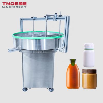 China Medical ; cosmetics; TNDE Biological Jam Sauce Glass Bottles Feeder Table Accumulations Electric Bottle Feeding Machine 800mm for sale