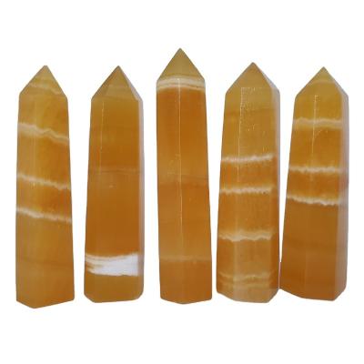 China Wholesale high quality natural point high quality natural yellow orange crystal tower calcite wand quartz Europe honey Crystal Obelisk healing for sale