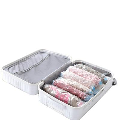 China Sustainable Plastic Transparent Airtight Seal Storage Bags Travel Space Saver Bags Hand Rolling Compressed Vacuum Bag for sale