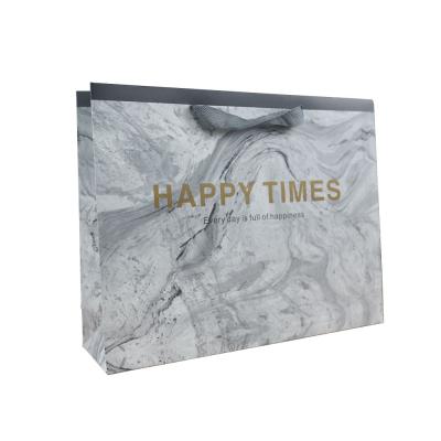 China Recycled Materials Luxury Custom Paper Bags With Clean Logo Printed Retail Clothing Packaging Paper Bag Shopping Paper Suitcase For Clothes for sale