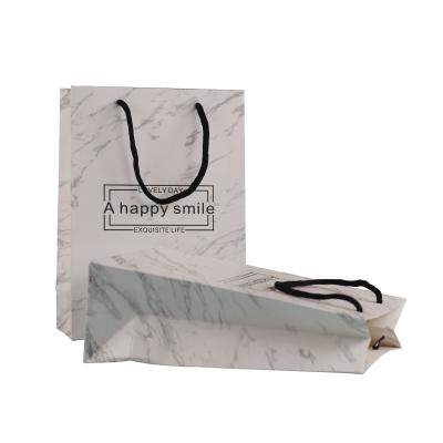 China Recycled Materials Paper Bag Gift Paper Bag Cheap Paper Bag With Handle for sale