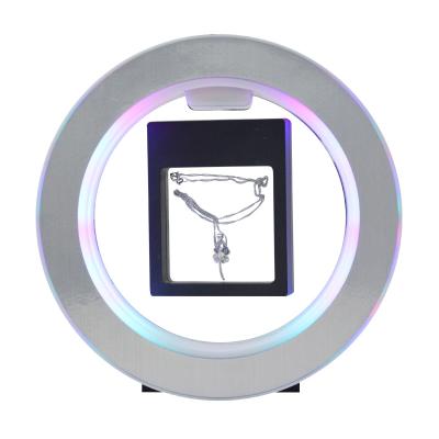 China Cheap Eco-friendly Magnetic Levitation Display Bracelet Necklace Price Display Levitating Earrings Show Rack For Bottle Glasses for sale