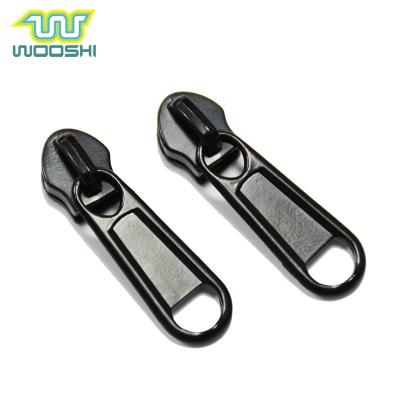 China Custom Metal Zipper Puller Fancy Metal Nickel Free And Zinc Alloy Non Lock Slider Zipper Puller for sale