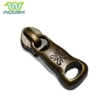 China Various Antique Nickel Free Metal Sample Order Brass Zipper Slider And Popular Design Puller For Backpack for sale