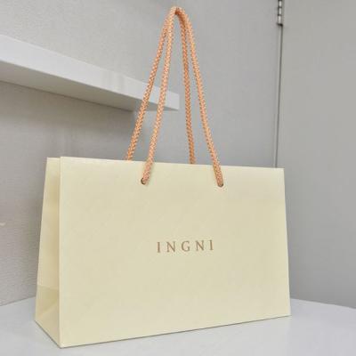 China Custom Logo Kraft Paper Bags Recyclable Biodegradable Shopping Bag Gift Bag With Handles for sale