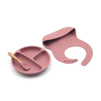 China Sustainable Food Grade Silicone Baby Feeding 3 Piece Set Toddler Dinner Plate Bib And Spoon Set for sale