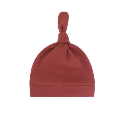 China Casual Organic Knot Hat Baby Knotted Hospital Top Hats Solid Colored Knot Hat for sale