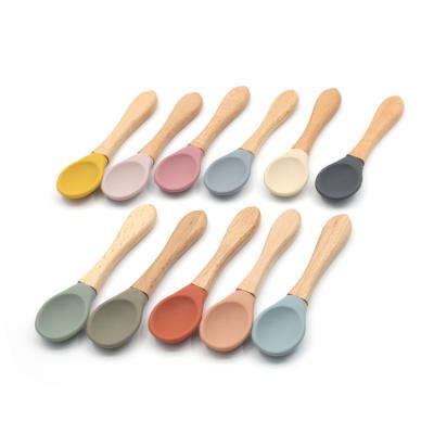 China BPA Free Baby Weaning Wooden Handle Baby Spoon and Wooden Spoon Silicone Fork for sale