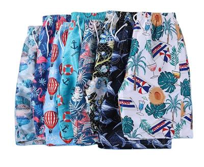 China 2022 Summer Couples QUICK DRY New Products Casual Pants Men's Quick Dry Beach Drawstring Loose Shorts Printed Sweat Shorts for sale