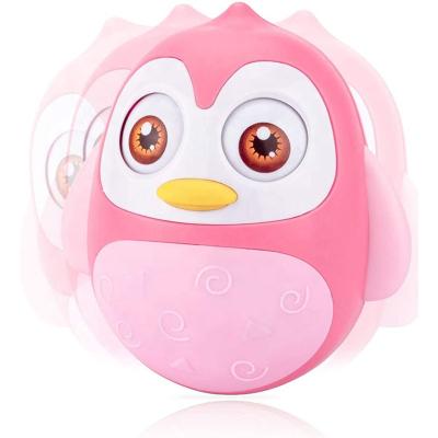 China Toy Roly Poly Baby Toys Developmental Tummy Time Penguin Musical Tumbler Wobbler for Babies for sale