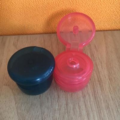 China China hot sale new shape 24mm plastic cosmetic packing flip top lid for sale