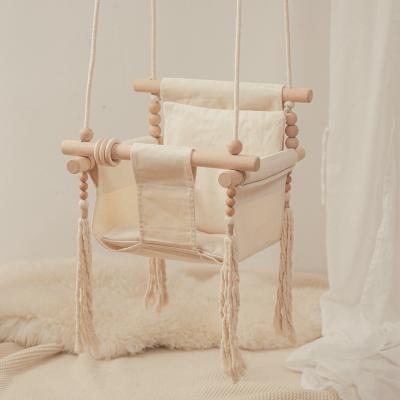 China New Modern Swing Chair With Gutta Percha Wooden Ring Tassel Baby Indoor Swing Chair Wholesale for sale