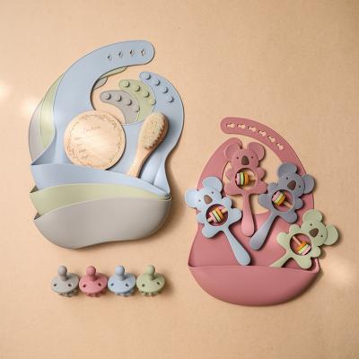 China Eco-freindly Baby Products Silicone Bib Teether Nipple Mileage Brush Five Pieces Set Newborn Set Wholesale for sale