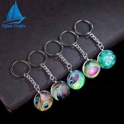 China Promotion Gift Custom Feather Dome Glass-Metal Key Chain With Handmade Elegant Peacock For Party Favors for sale