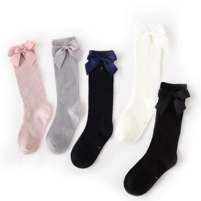 China Autumn QUICK DRY Warm Cotton Solid Pattern With Colorful Bow School Students Girls Over The Knee Socks for sale