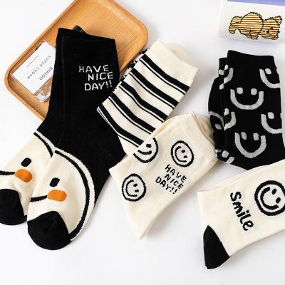 China 2022 New Style Funny Embroidery Smile Face Thick Winter Socks Woman Custom Made QUICK DRY Medium Socks for sale