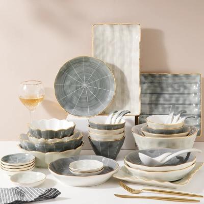 China Sustainable European Style Tableware Gray Gold Rim Luxury Ceramic Irregular Dinnerware Sets For Restaurants for sale