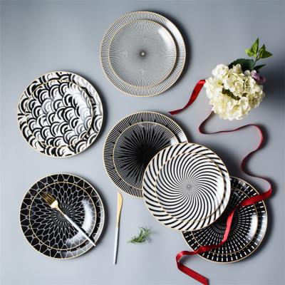 China Viable Geometric Tableware Round Shape Gold Rim Luxury Restaurant Black Ceramic Pasta Steak Dinner Plates Sets for sale