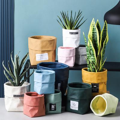 China Modern Creative Kraft Paper Bag Shape Nordic Plant Pot White Ceramic Flower Pot For Home Decor for sale