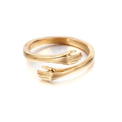 China Trendy Wholesale Polished Embrace Ring For Fashion Stainless Steel 18K Gold Love Charm Hand Couple for sale