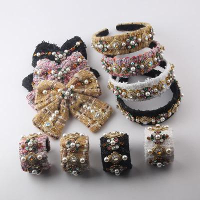 China 2022 European and American style luxury Bling fabric rhinestone pearl colorful set bracelets bow hair cuts woman street headbands for sale