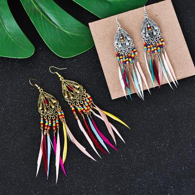 China 2022 New Fashion Retro Long Ethnic Hollow Feather Earrings European And American Bohemia Colorful Rice Beads Tassel Earrings for sale