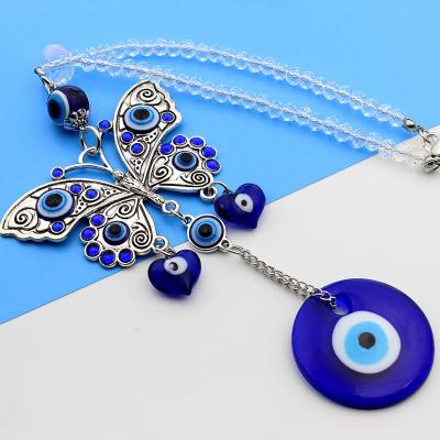 China Art Deco Metal Turkish Blue Greek Evil Eye Glass Nazar Amulets With Butterfly Bag Door Car Mirror Hanging Ornament for sale