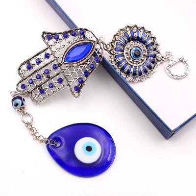 China Art Deco Turkish Nazar Blue Hamsa Hand Wall Art Metal Evil Eye Glass Protection Decor Good Luck Charm Hanging Gift for sale