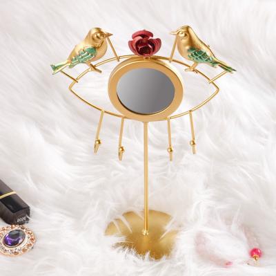 China Art Deco Beauty Bird Flower Metal Jewelry Display Rack Table Makeup Organizer With Evil Eye Standup Mirror For Women Girls for sale