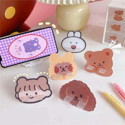 China New Promotional Cute Cartoon Table Phone Stand Gift Portable Mobile Phone Stand Desktop Acrylic Stand for sale