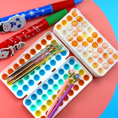 China Schools & Desks Fast Jumping Silicone Decompression Push Bubble Stationery Box Stress Reliever Purse Pop Bubbles Simple Stationery for sale