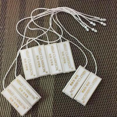 China Hang On Wholesale Customized Molded Paper Plastic Logo Jewelry Tags With Elastic String for sale