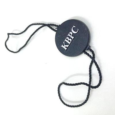 China Sustainable Custom Emboss Plastic Garment Tags Apparel Label Seal String for sale