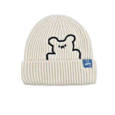 China COMMON Autumn and winter cute little bear embroidered knitted hats female students versatile warm smile face labeling ear -cooled ear for sale