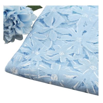 China Garment Chinese factory sells high quality beautiful light blue Swiss dress burnt fabric for sale