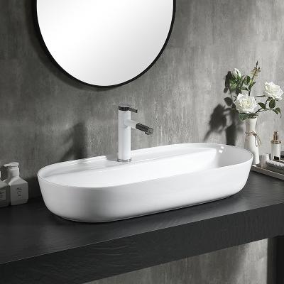 China Modern New Design Sinks Ceramic Oval Glossy White Art The Wash Basin Countertop Bathroom Basin Sink for sale