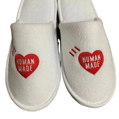 China Disposable Slippers Customized White Logo Spa Slippers Slippers Hotel Disposable Hotel Guest Slippers for sale