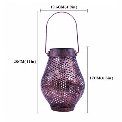 China Long Life Waterproof Solar Power Metal Hanging Craft Led Lantern Vintage Style Iron Hollow Artwork Lamp Garden Table Patio Yard for sale