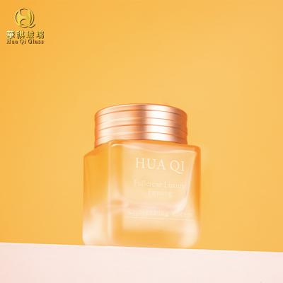 China Glass Bottles Custom Face Cream Glass Bottles Recyclable Unique Glass Cosmetic Packaging Jars 50g Square for sale